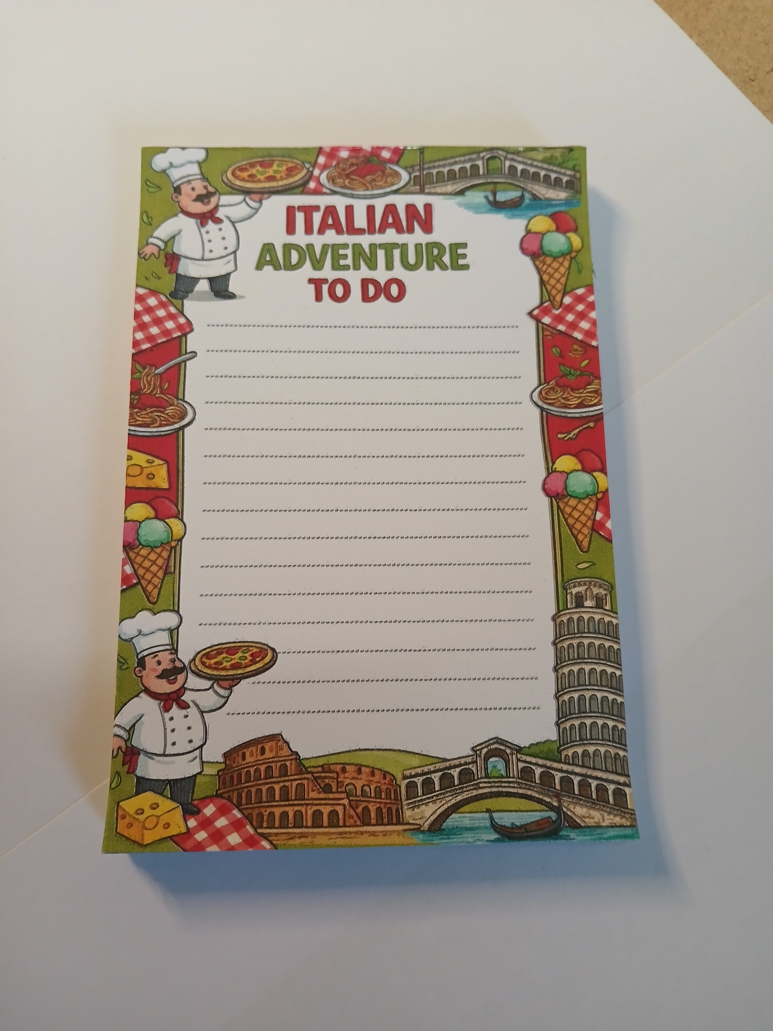 Notepad with Italian-themed design and 'Italian Adventure To Do' text on a white background